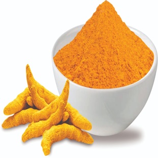 A bowl filled with vibrant turmeric powder, ready to be used in cooking or for its health benefits.